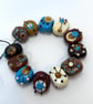 Handmade brown, ivory and turquoise patterned lamp work glass beads - Image 6