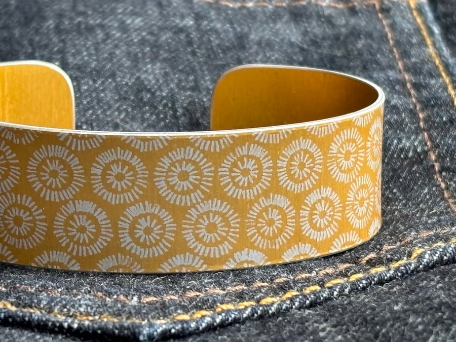 Geometric sunshine pattern cuff bracelet yellow