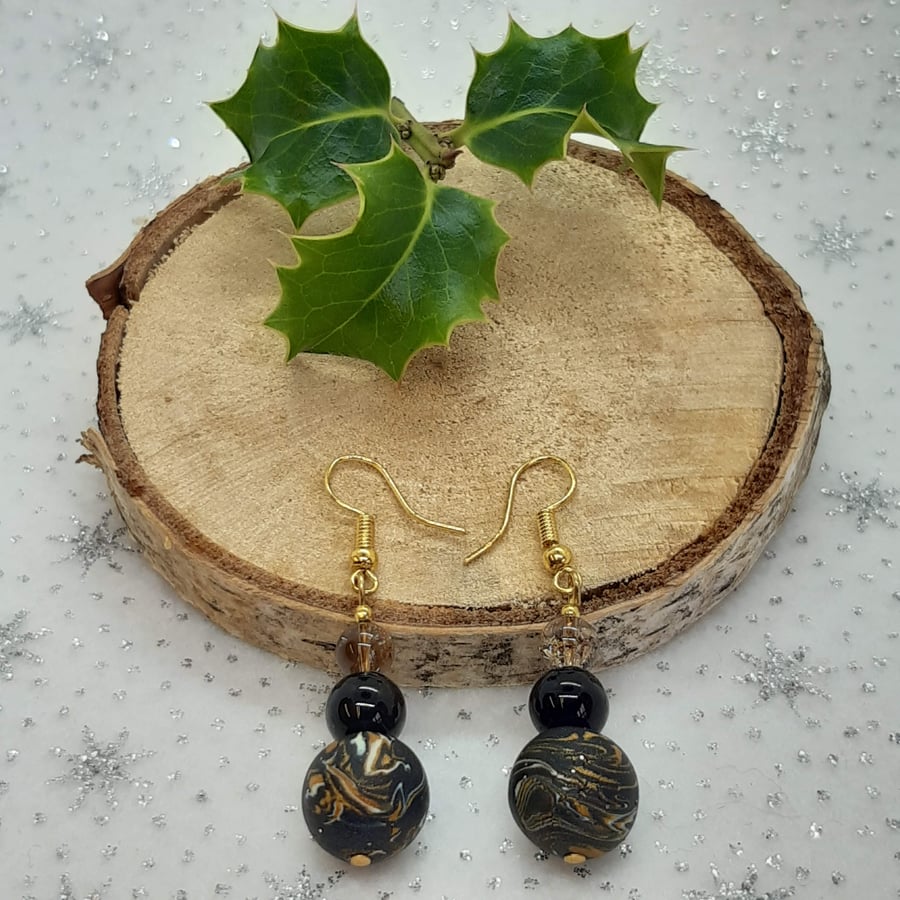 Black, gold and white dangly earrings