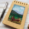 Embroidered landscape A6 raffia reporters notepad. 