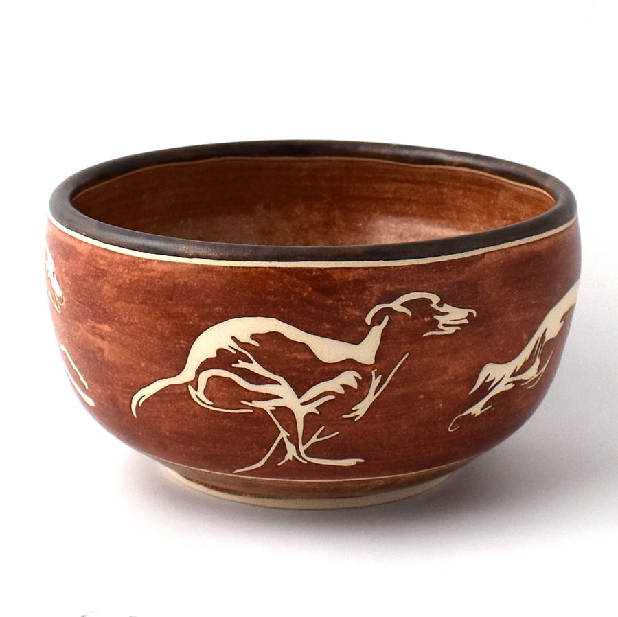 A329 - Ceramic bowl with running dogs design  (Free UK postage)