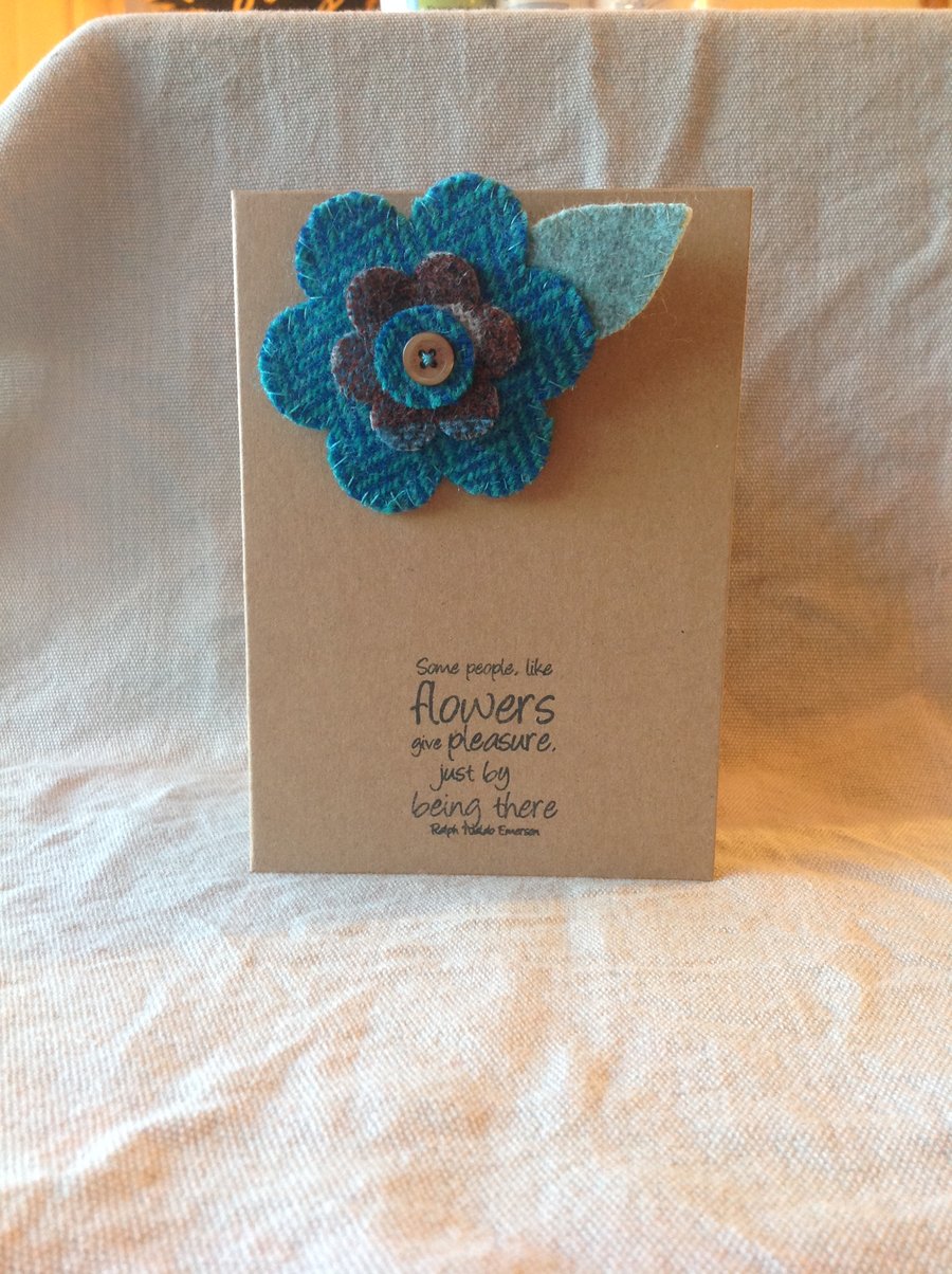 A flower shaped, hand sewn brooch, Harris tweed, backed with felt.
