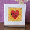 Handmade patterned red heart card. 