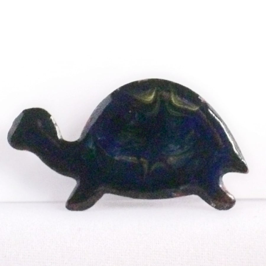 brooch - tortoise: scrolled gold on dark blue