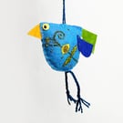 Blue coloured felt bird with hand embroidered body