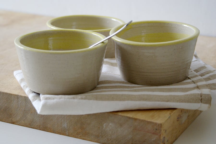 Three yellow swirled hand thrown stoneware dishes - glazed in transparent