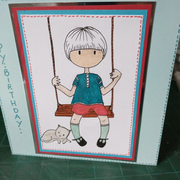 Cute boy on swing birthday card