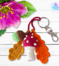 Red toadstool, acorn and oak leaves crochet bag charm. Toadstool keyring