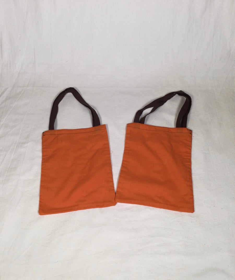 Coloured, reusable, recycled cotton fruit and vegetable shopping bags.
