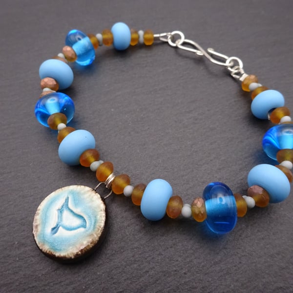 blue lampwork glass bird bracelet