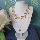Gold ribbon leaf choker necklace and silver chain