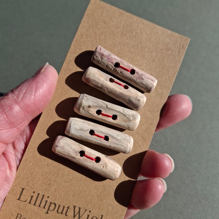 Five driftwood toggle buttons