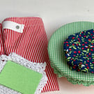 Sustainable kitchen gift set. Five items in red, blue and green