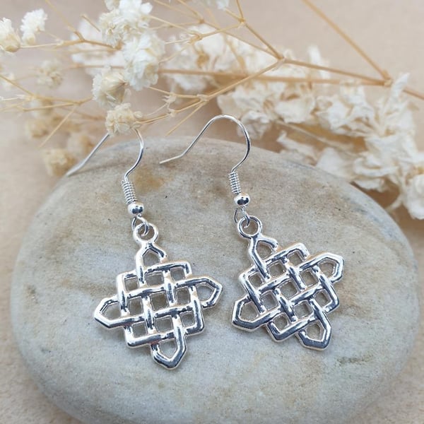 silver plated earrings with beautiful silver plated lattice work charms 
