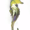   seahorse brooch - scrolled purple and white over yellow on clear enamel