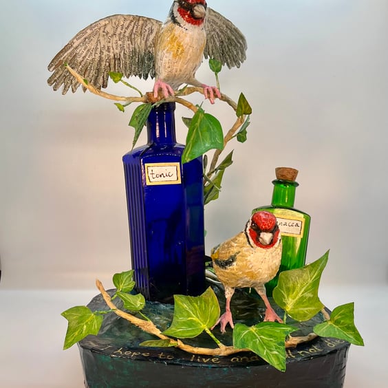 Papier maché goldfinch sculpture 