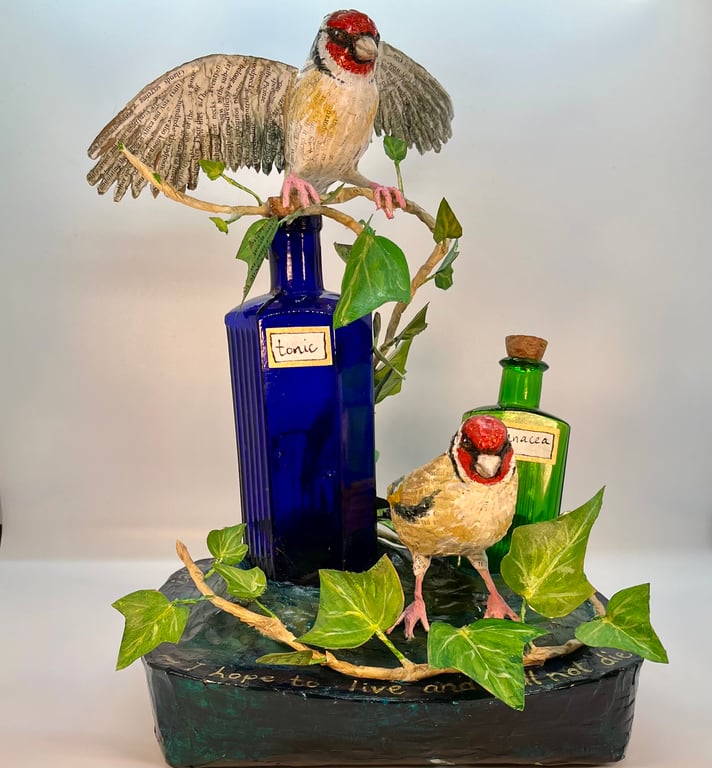 Papier maché goldfinch sculpture 