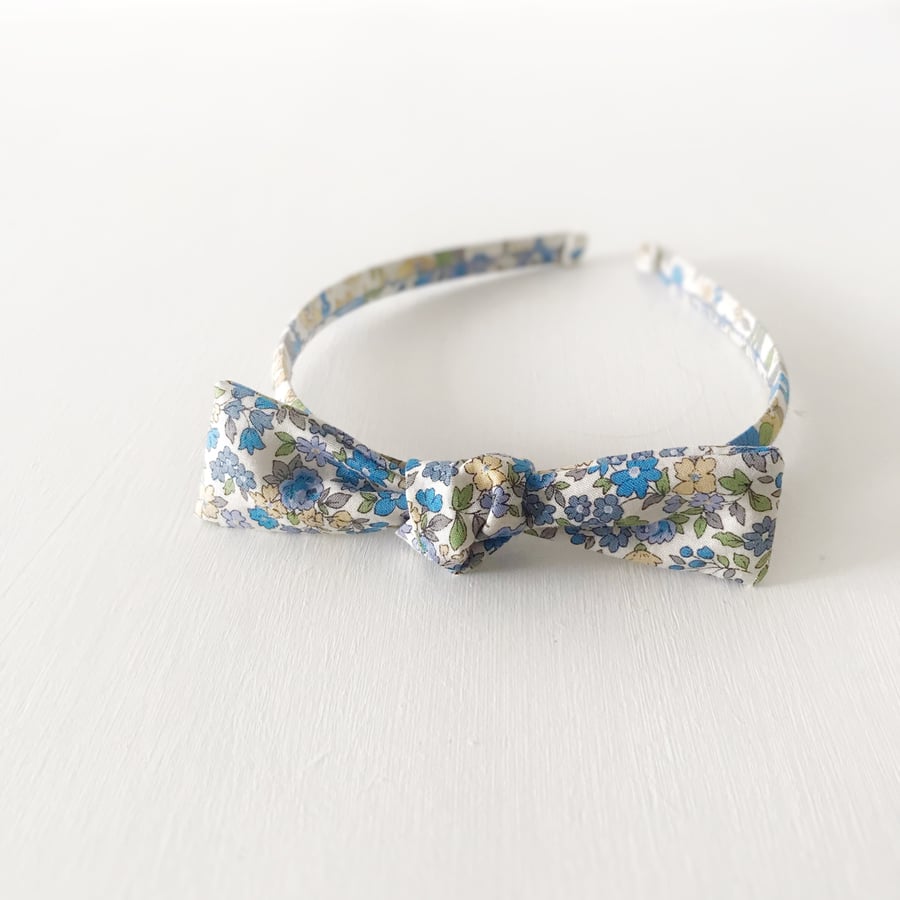 Alice Band in Floral Blue With Bow Embellishment 