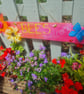Handmade, upcycled wooden "bees welcome" sign