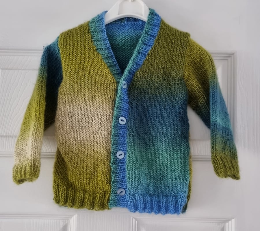12-18 months hand knitted  cardigan in different tones of blue & green 