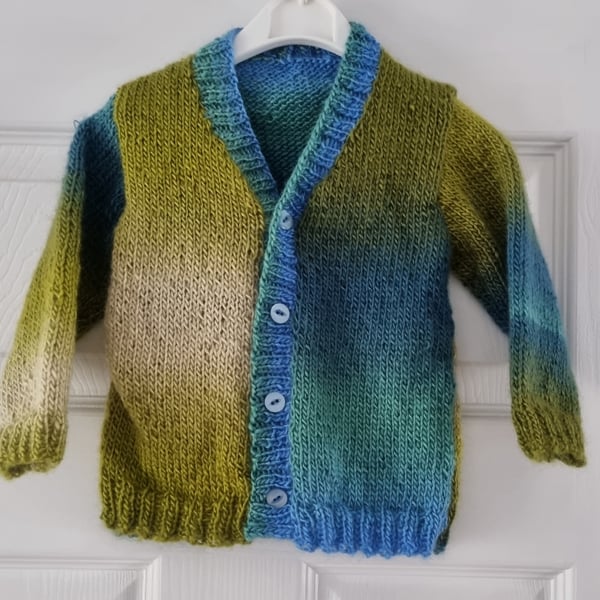 12-18 months hand knitted  cardigan in different tones of blue & green 