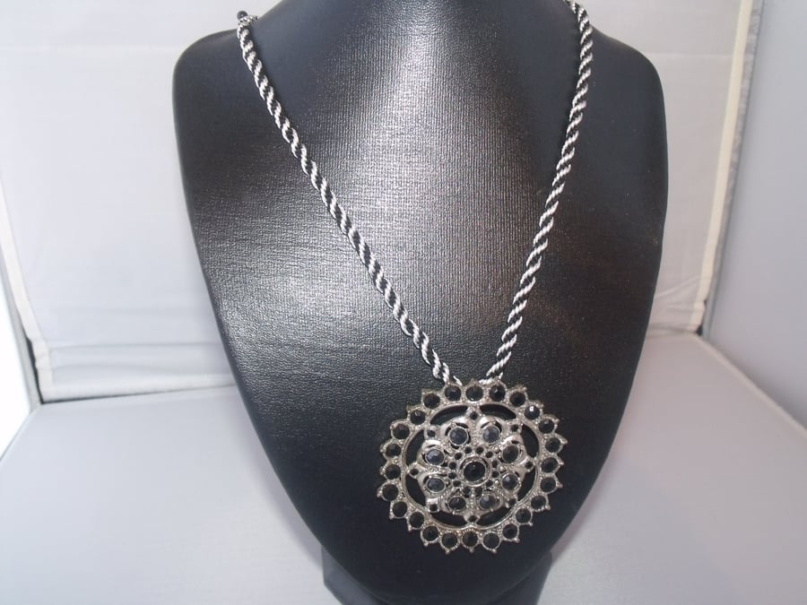 Large Silver and Black Pendant on Black and White Braid
