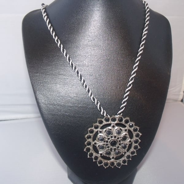Large Silver and Black Pendant on Black and White Braid