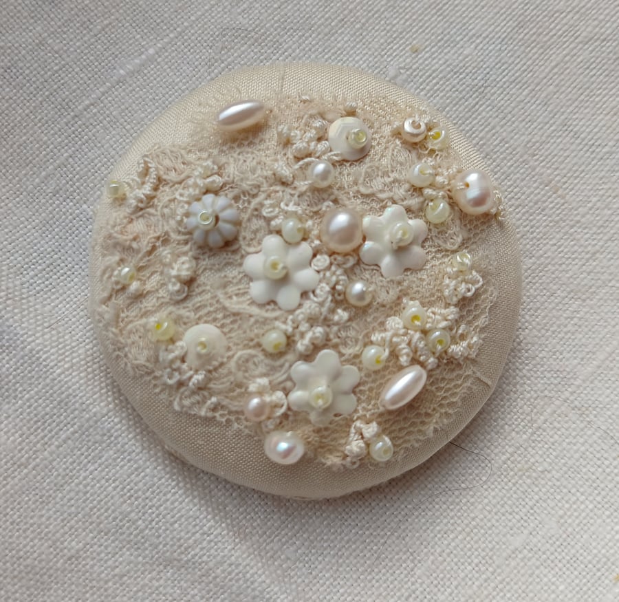 The cream brooch with lace, beads and sequins and lots of french knots