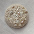 The cream brooch with lace, beads and sequins and lots of french knots