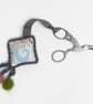 Scissor keeper with needlepoint stripes and crochet trim with balls - Image 2