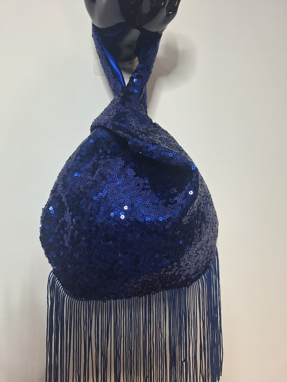 Blue sequin Japanese Knot bag with 14cm tassel trim and satin lining.