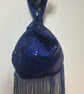 Blue sequin Japanese Knot bag with 14cm tassel trim and satin lining.