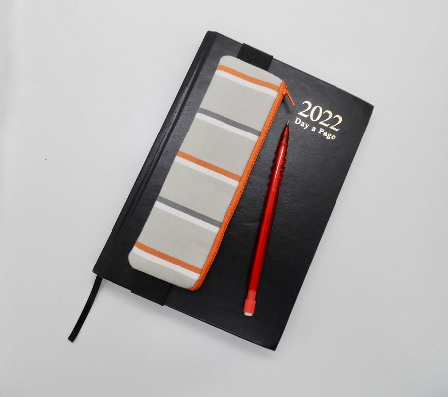 Mini pencil case grey and orange elasticated attach to a diary journal notebook 