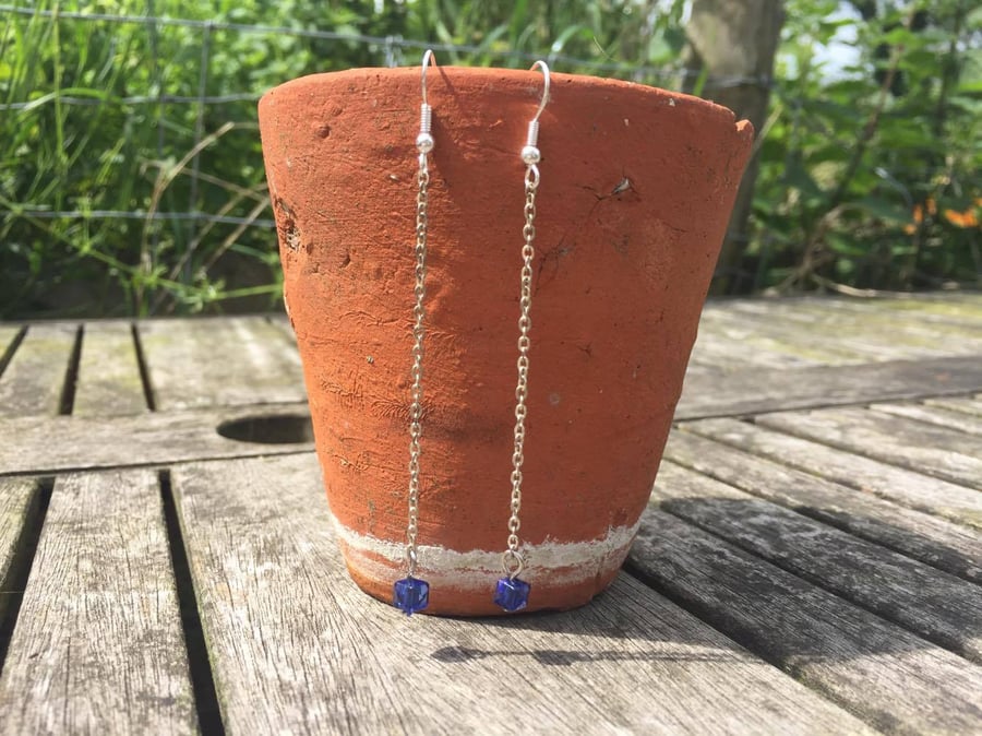 Long dangle silver earrings with blue bead
