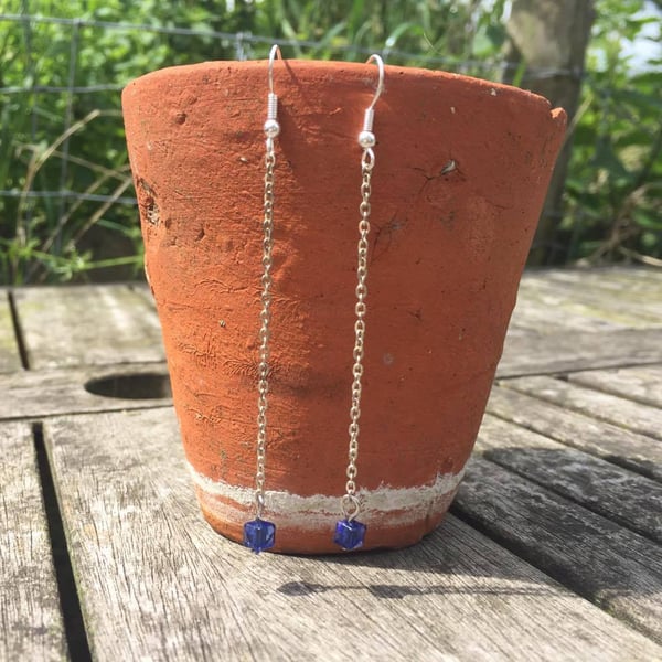 Long dangle silver earrings with blue bead