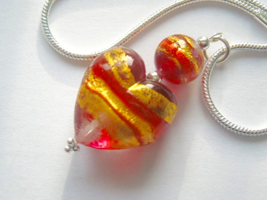 Red and gold Murano glass heart pendant with stering silver.