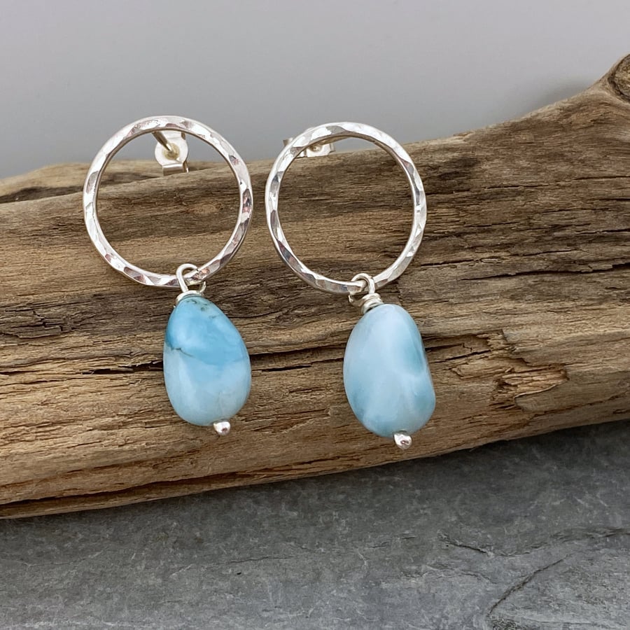 Round silver studs with pale turquoise colour Larimar beads dangling below.