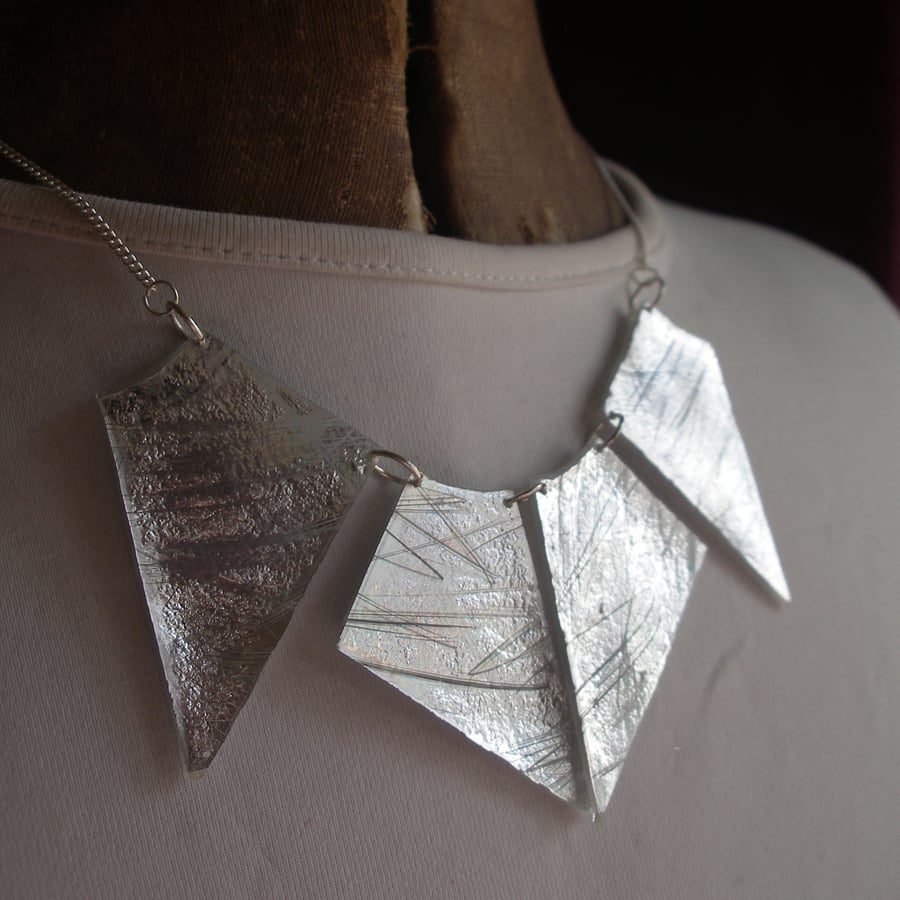 Dramatic large silver four piece necklace