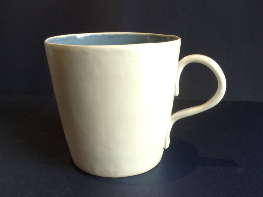 Large hand thrown blue and white ceramic mug