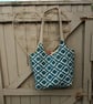 Two bags in one.  Lined tote bag