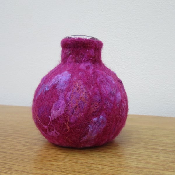 Small pink vase.  Glass vase wrapped in hand made dark pink magenta felt cover 