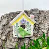 Small Ceramic bird house with lilac flower