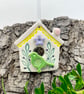 Small Ceramic bird house with lilac flower