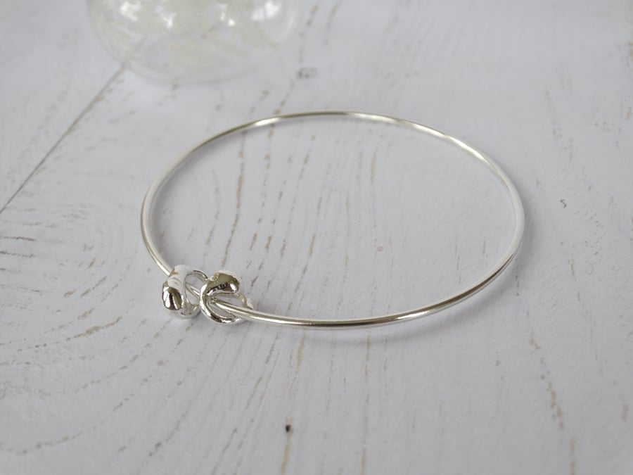 Silver bangle with two artefact charms in recycled silver