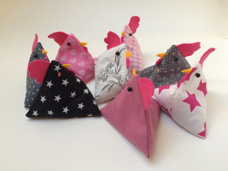 Pattern or paper weight bean bag chickens. Pink and grey
