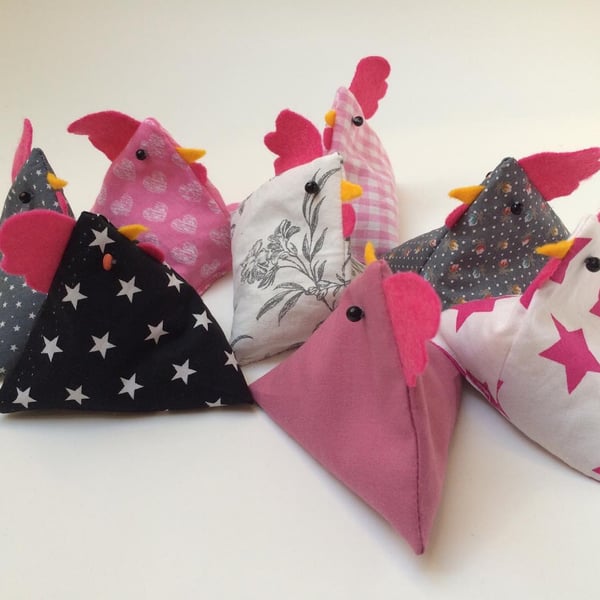 Pattern or paper weight bean bag chickens. Pink and grey