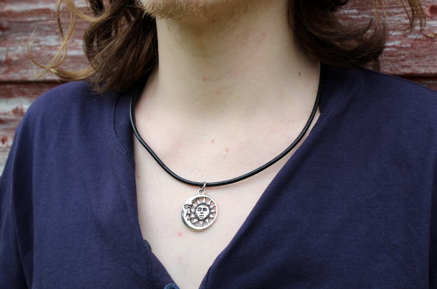 Large silver sun moon face charm leather thong necklace