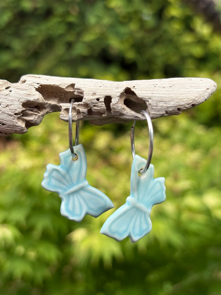 Sterling Silver Endless Hoop Earrings with Blue Glazed Porcelain Butterflies