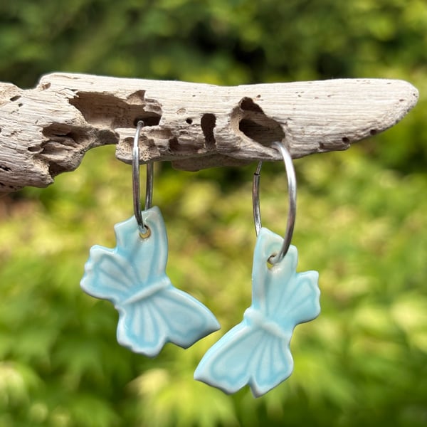 Sterling Silver Endless Hoop Earrings with Blue Glazed Porcelain Butterflies
