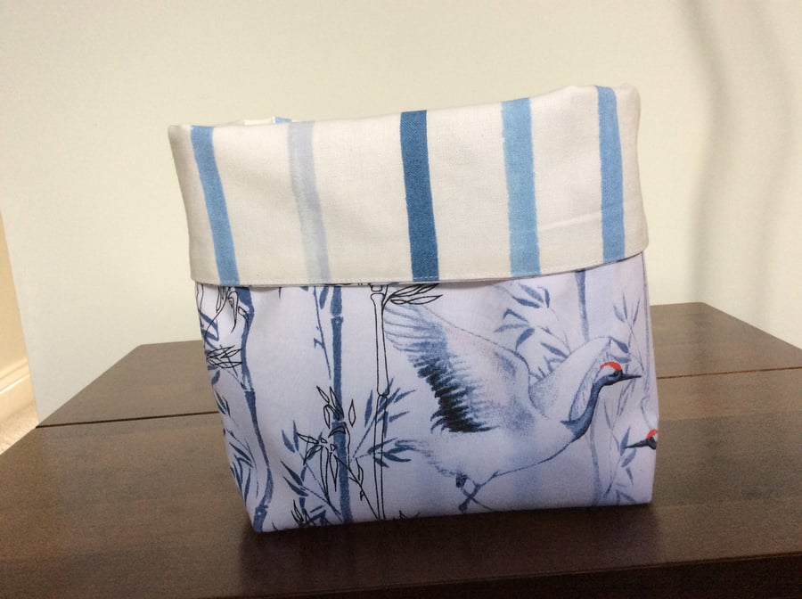 Reversible fabric basket in Painterly Stripe Blue fabric and Crane cotton fabric